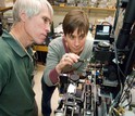 Scientists Rob Olson and Heidi Sosik work on the FlowCytobot automated submersible plankton sensor.